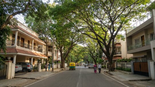 Koramangala neighborhood street view with modern buildings and calm vibe