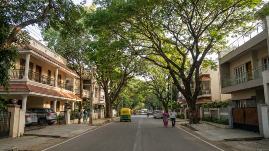 Koramangala neighborhood street view with modern buildings and calm vibe