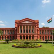Attara Kacheri red colonial building with grand columns in Bengaluru
